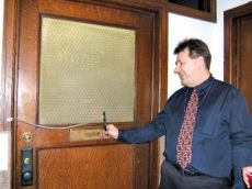 tim cuts the ribbon
